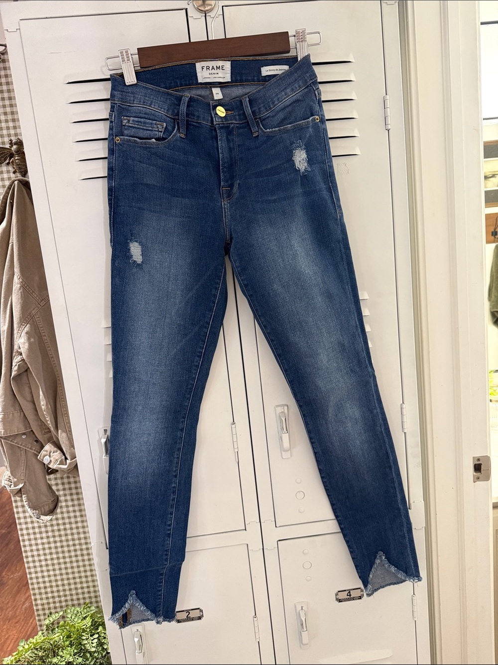 Frame Denim Skinny Jeans in Dark Blue Wash with Distressed Accents